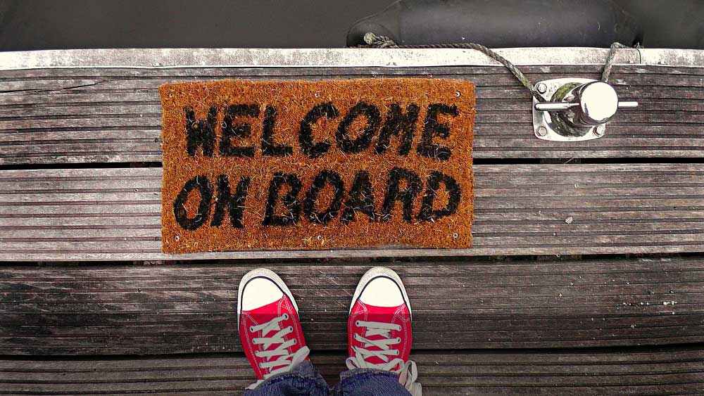 welcome on board mat with red shoes