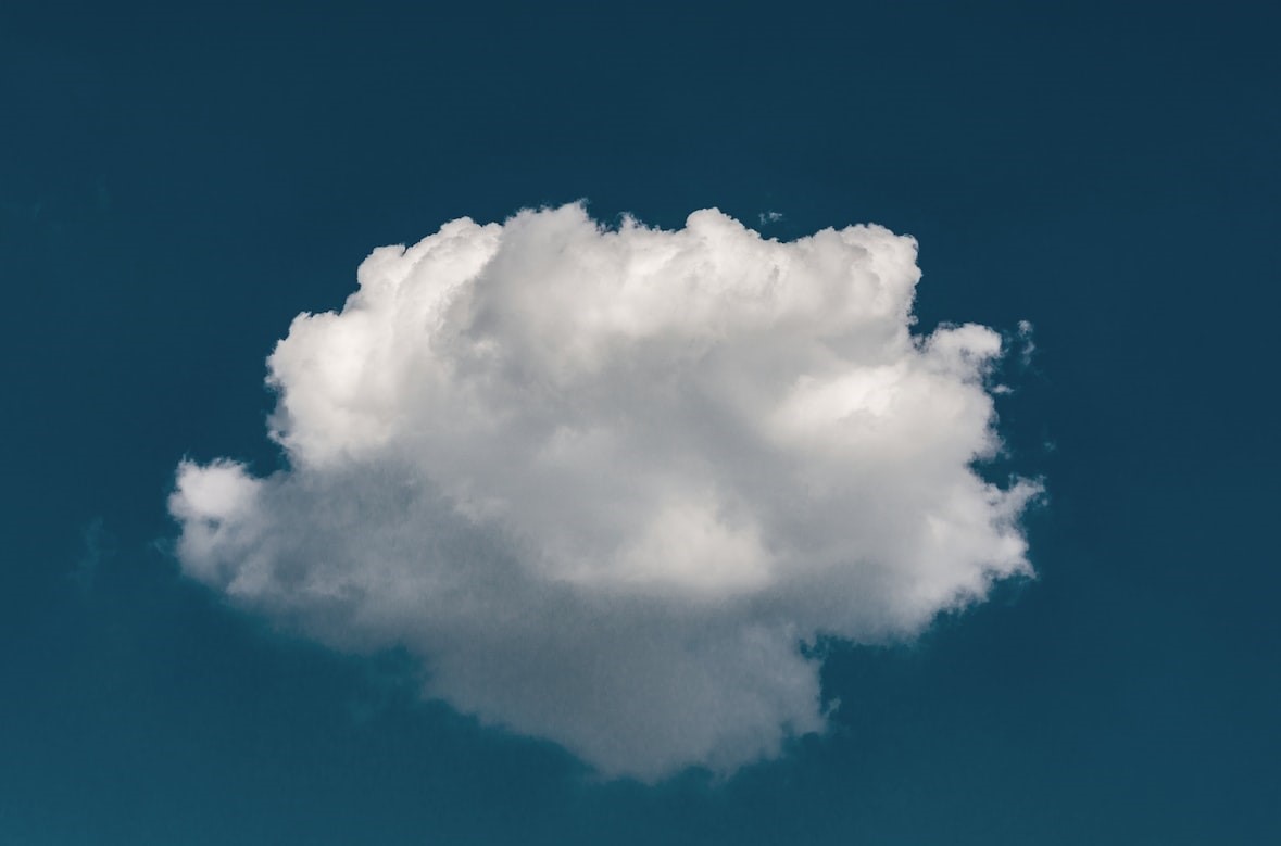A white cloud in a blue sky, representing cloud computing